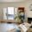 Bright, tidy office workspace with a desk and indoor plants